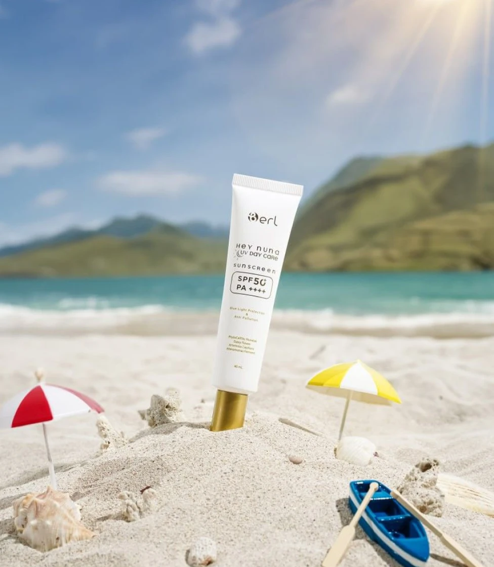 Sun Harmony Cream bottle on beach